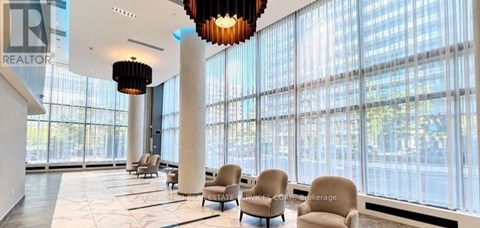 A large room with a lot of windows and chairs.