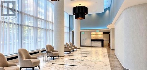 A row of chairs are lined up in a hallway.