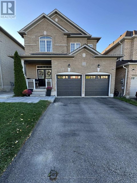 A house with a driveway and garage doors.