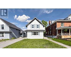 A house with a lawn in front is for sale.