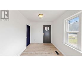 A room with a door and a window.