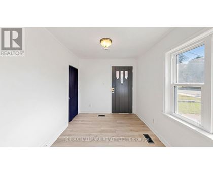 A room with a door and a window.
