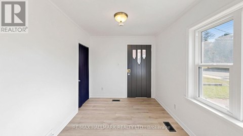 A room with a door and a window.
