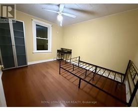 A room with a bed frame in it.