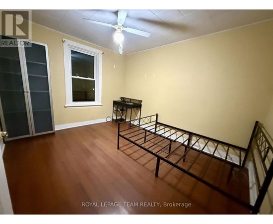 A room with a bed frame in it.