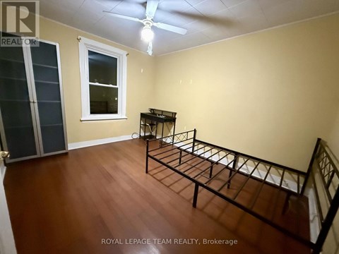 A room with a bed frame in it.