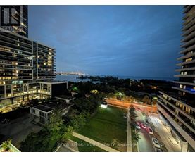 A nighttime view of a cityscape with a building labeled "REALIGRO".