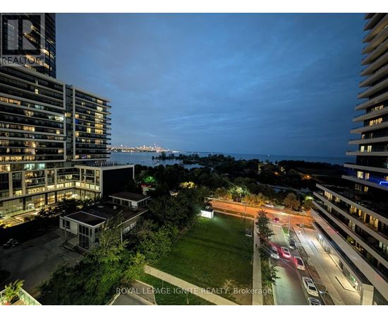 A nighttime view of a cityscape with a building labeled "REALIGRO".