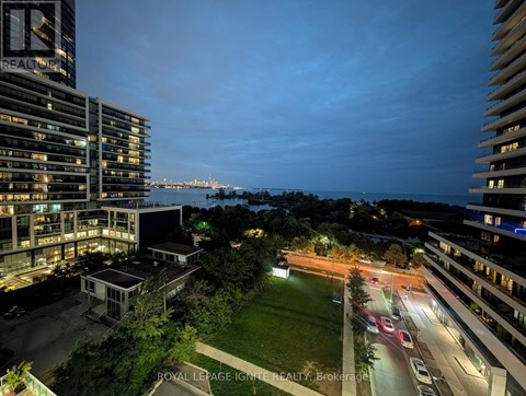 A nighttime view of a cityscape with a building labeled "REALIGRO".