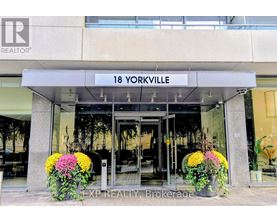 The entrance to a realtor office with a sign that says 18 Yorkville.