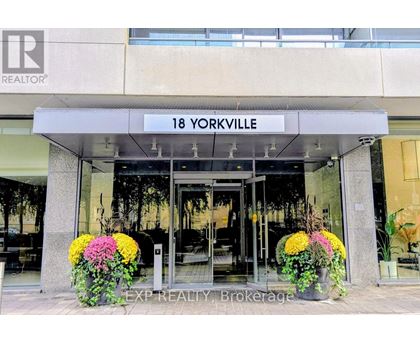 The entrance to a realtor office with a sign that says 18 Yorkville.