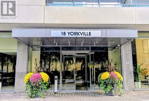 The entrance to a realtor office with a sign that says 18 Yorkville.