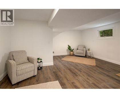 A living room with a chair and a couch.