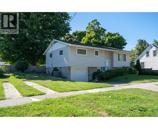 A house with a garage is for sale.