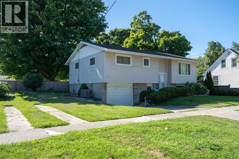 A house with a garage is for sale.