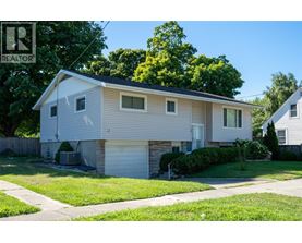 A house with a garage is for sale.