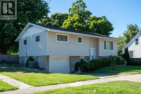 A house with a garage is for sale.