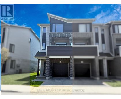 A modern two-story house with a garage is depicted in the image.