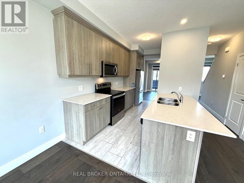 A kitchen with wooden cabinets and a countertop.