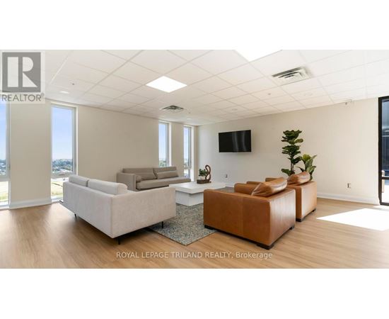 A living room with a flat screen TV mounted on the wall.