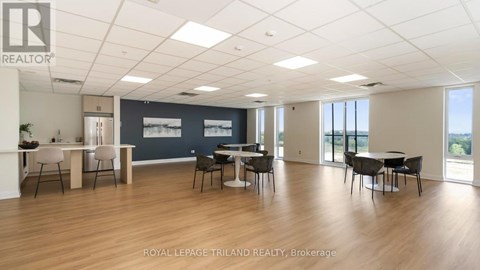 A spacious office room with a desk and chairs.