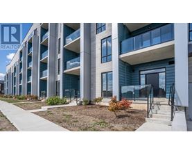 A modern building with a balcony and a sign that says "REALTOR".
