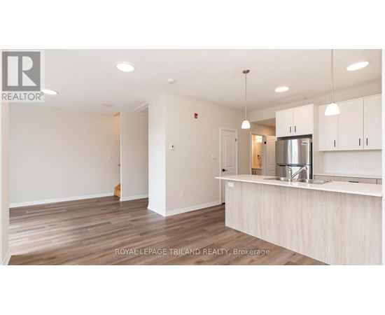 A kitchen area with a counter and cabinets.