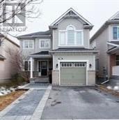 A house with a grey garage door is in front of a house with a brown garage door.