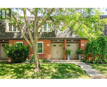 A house with a tree in front of it.