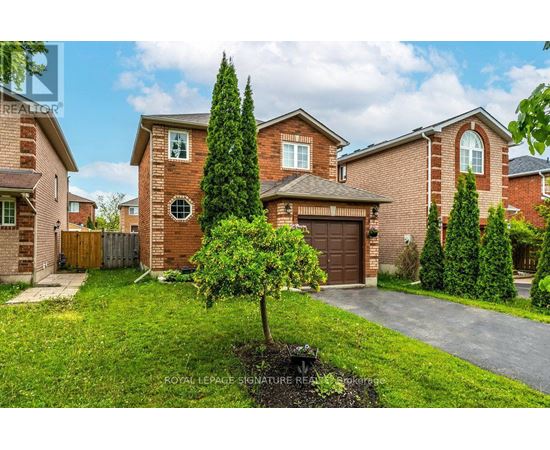 A house with a brown brick exterior and a tree in front of it.