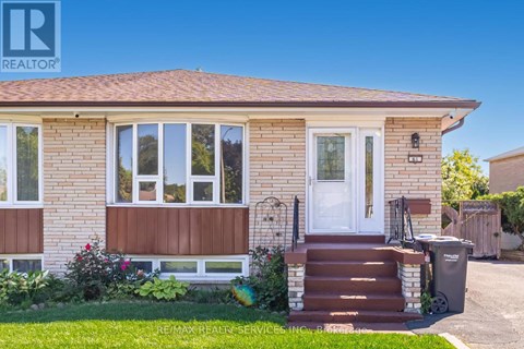 A house with a brown front door and a white window.