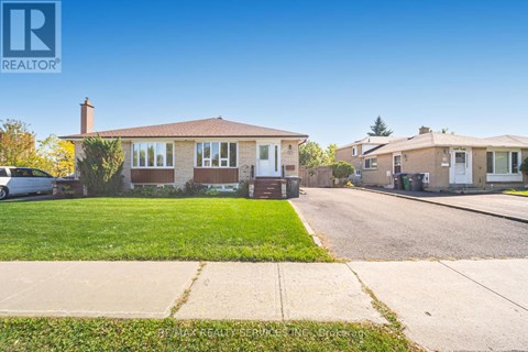 A realtor photo of a house with a car parked in front.