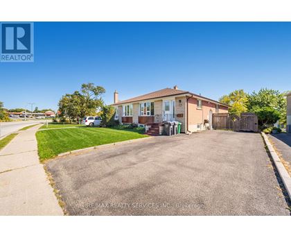 A house with a driveway in front of it.