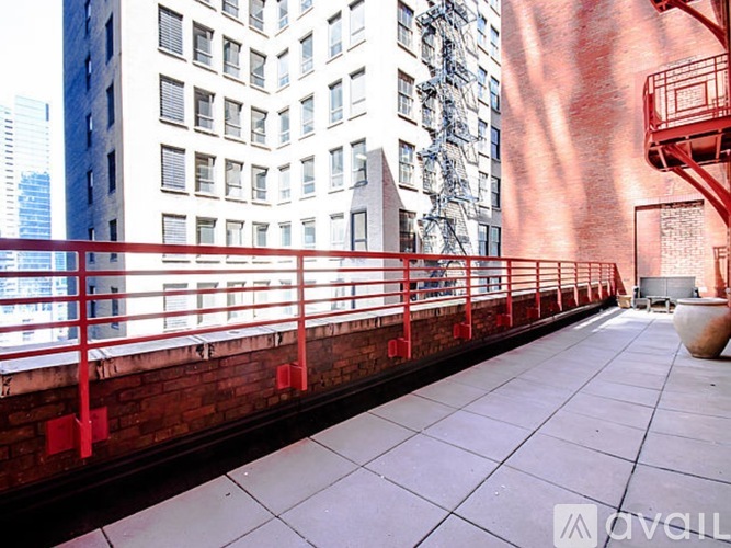 A red fire escape on a building.