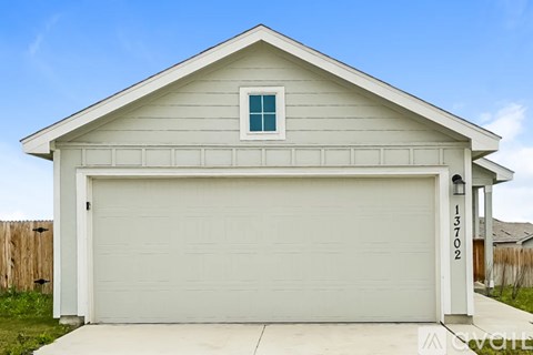 A garage with the number 13702 on the side.