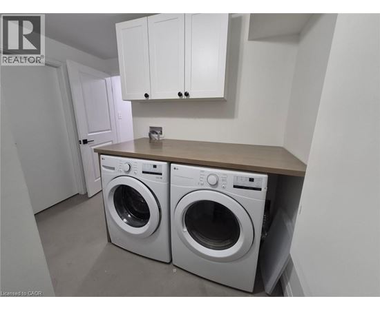 A laundry room with a washer and dryer.