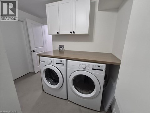 A laundry room with a washer and dryer.