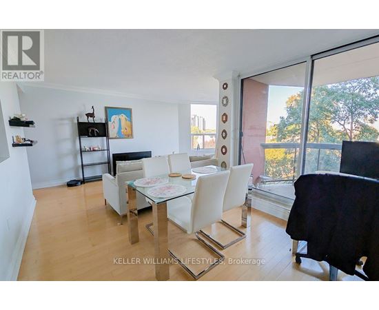A dining room with a glass table and chairs.