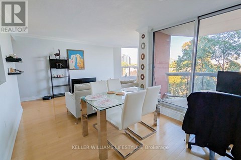 A dining room with a glass table and chairs.