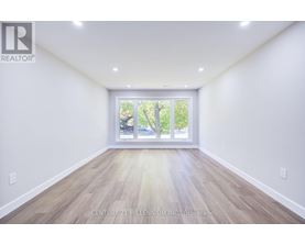A spacious room with Century 21 Millennium Inc. Brokerage watermark.