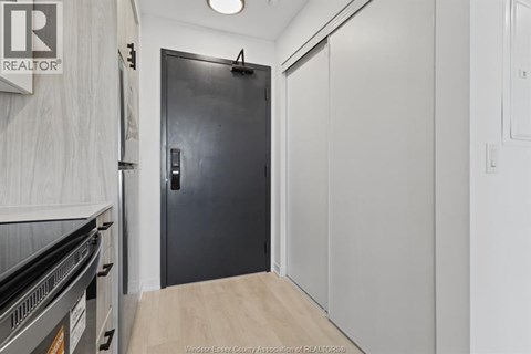 A black door with a handle and a number 4 on it.