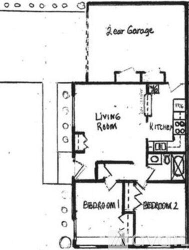 A floor plan of a two bedroom apartment with a living room, kitchen and two garages.