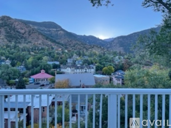 A mountain range is in the background of a town.