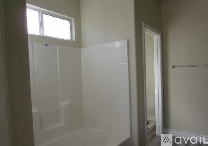 A bathroom with a walk in shower and a toilet.