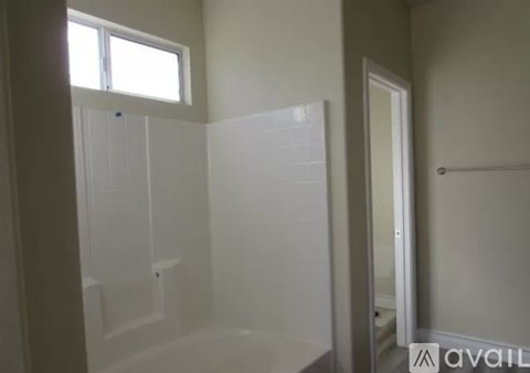 A bathroom with a walk in shower and a toilet.