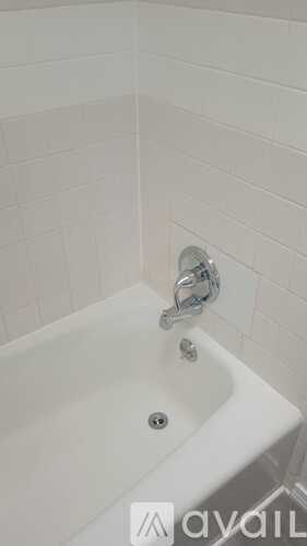 A white bathroom sink with a silver faucet.