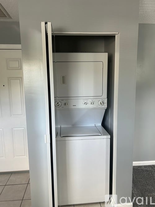 A white oven with the door open in a kitchen.