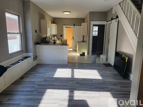 A spacious kitchen with a large island in the middle.
