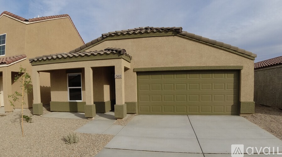 A house with a garage door that is open.