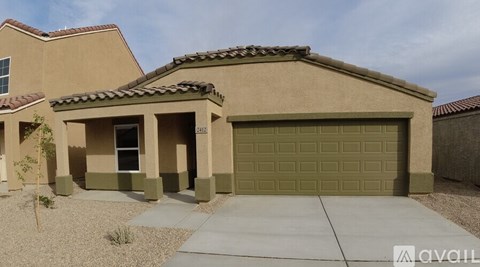 A house with a garage door that is open.